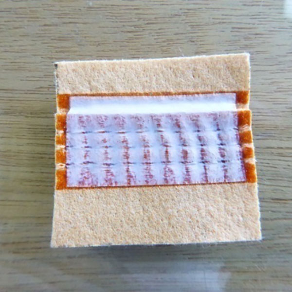 石炭火力発電所におけるフィルターバッグの漏れ防止のオプション：接着コーティングプロセスとPTFEテープの応用プロセスの比較